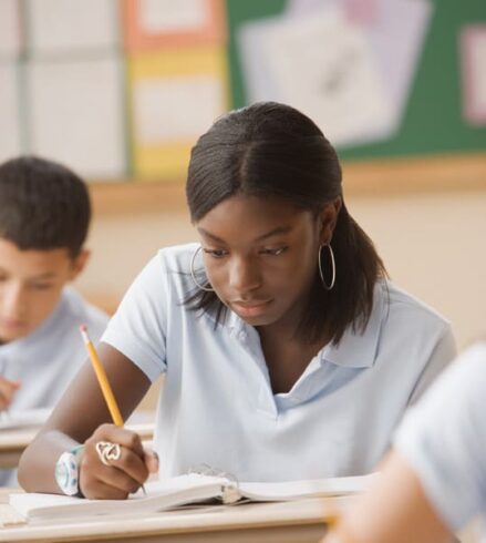 Female student writing in school planner