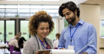 Two teachers looking at paperwork