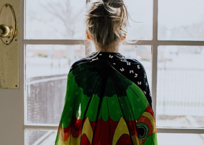 Girl stood at window